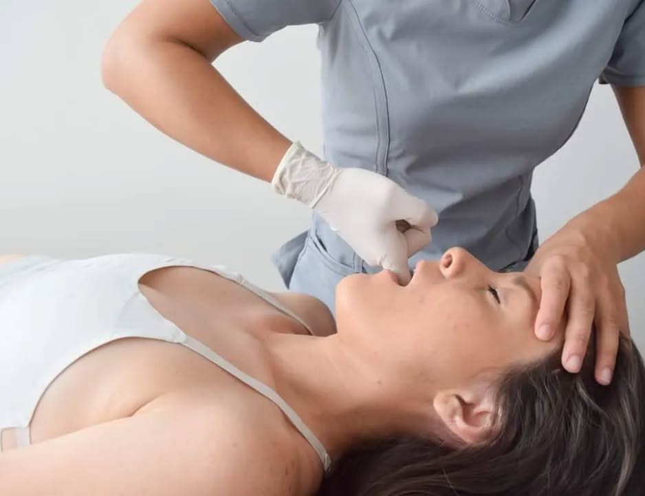 Temporomandibular joint manual therapy